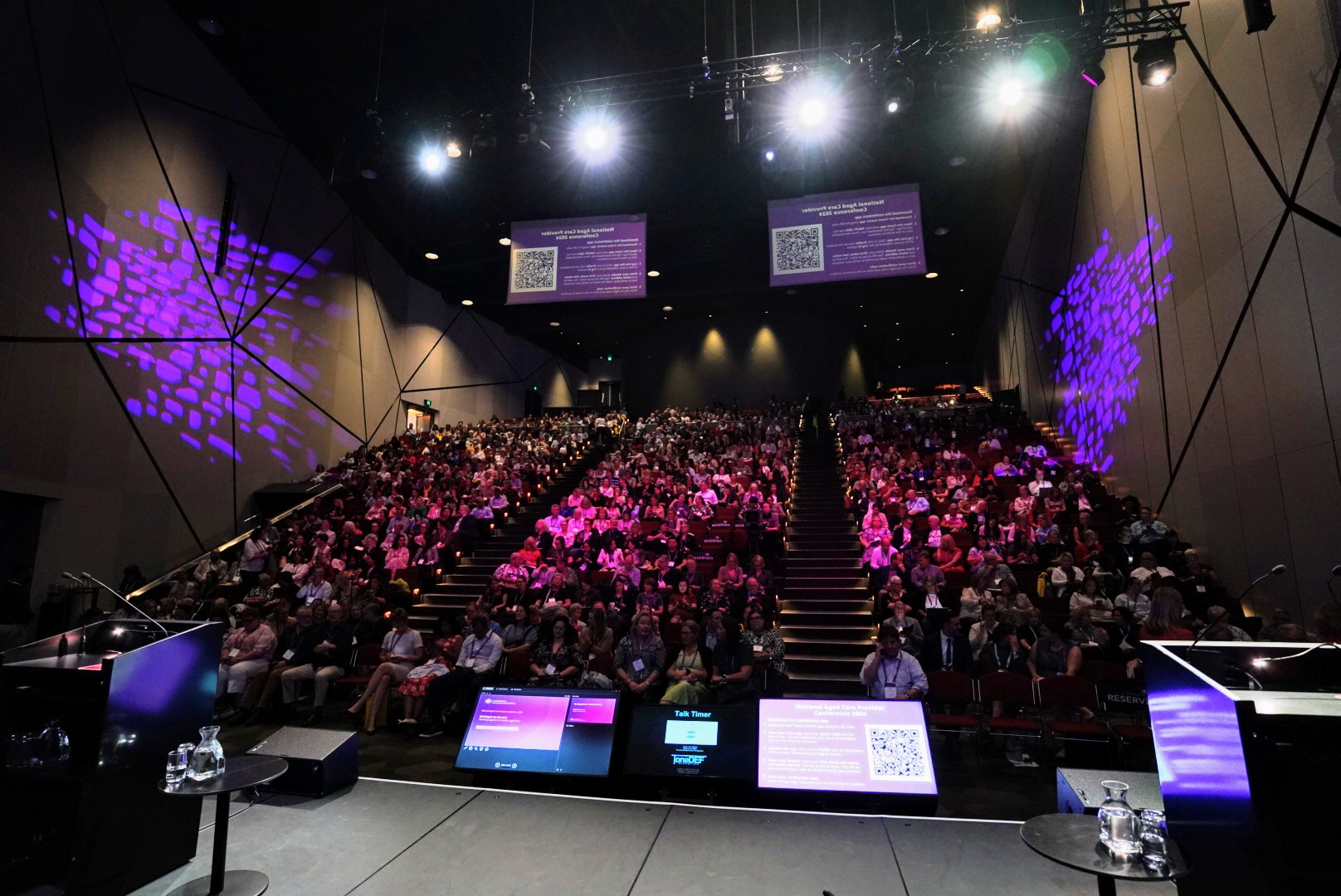 Image of audience sitting in conference theatre