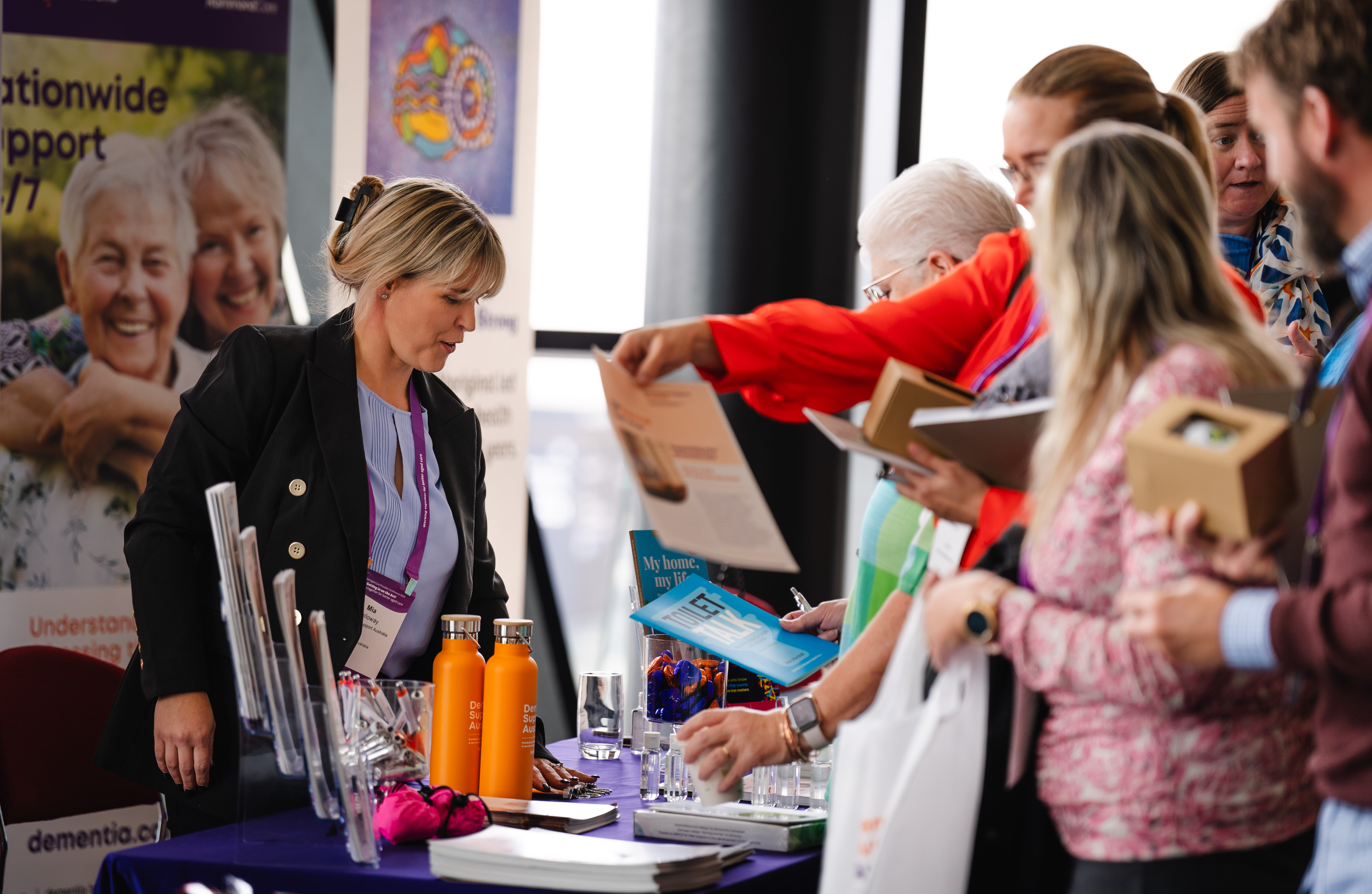 Attendees at conference stand